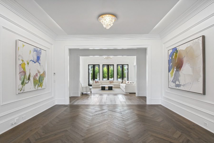 Interior hallways with artwork on white walls of luxury home, Atlantic Control Technologies (ACT)